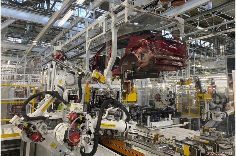 Nissan s Intelligent Factory: Robots Manage Assembly, Painting, and Self-Inspection
