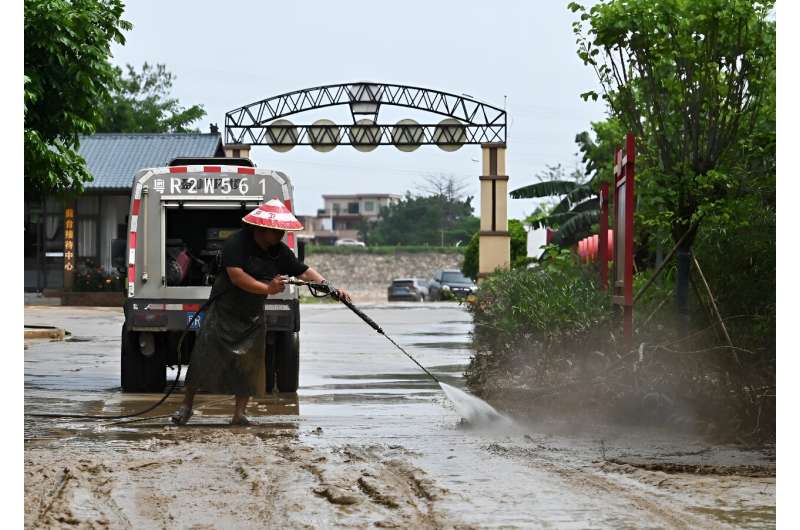 China Floods: Residents Salvage Property Amidst Warnings of Further Rain