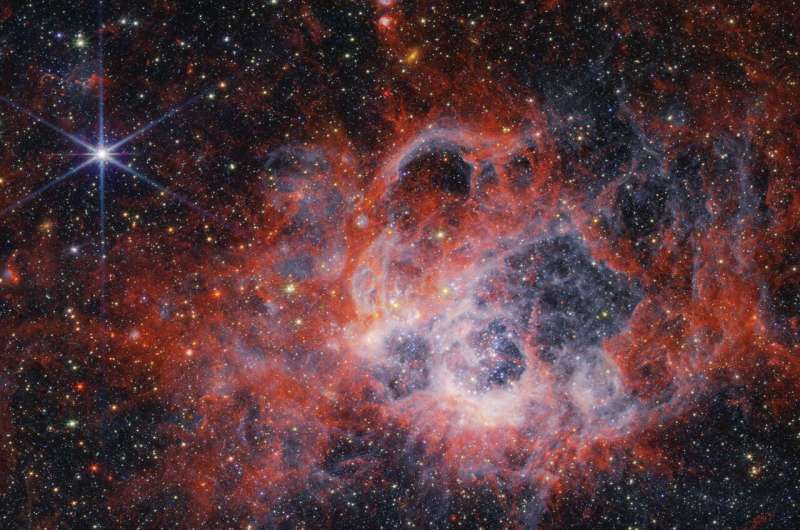 Webb Telescope Reveals Stellar Wind Sculpting in NGC 604 Star-Forming Region