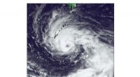 How Environmental Helicity Influences the Outer-Core Size of Tropical Cyclones