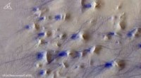Hooke Crater on Mars: Wind‑Sculpted Ripples and Dust Devil Tracks