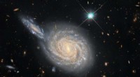 Hubble Reveals Hidden Clues in Spiral Galaxy NGC 105 and Its Neighboring Companion